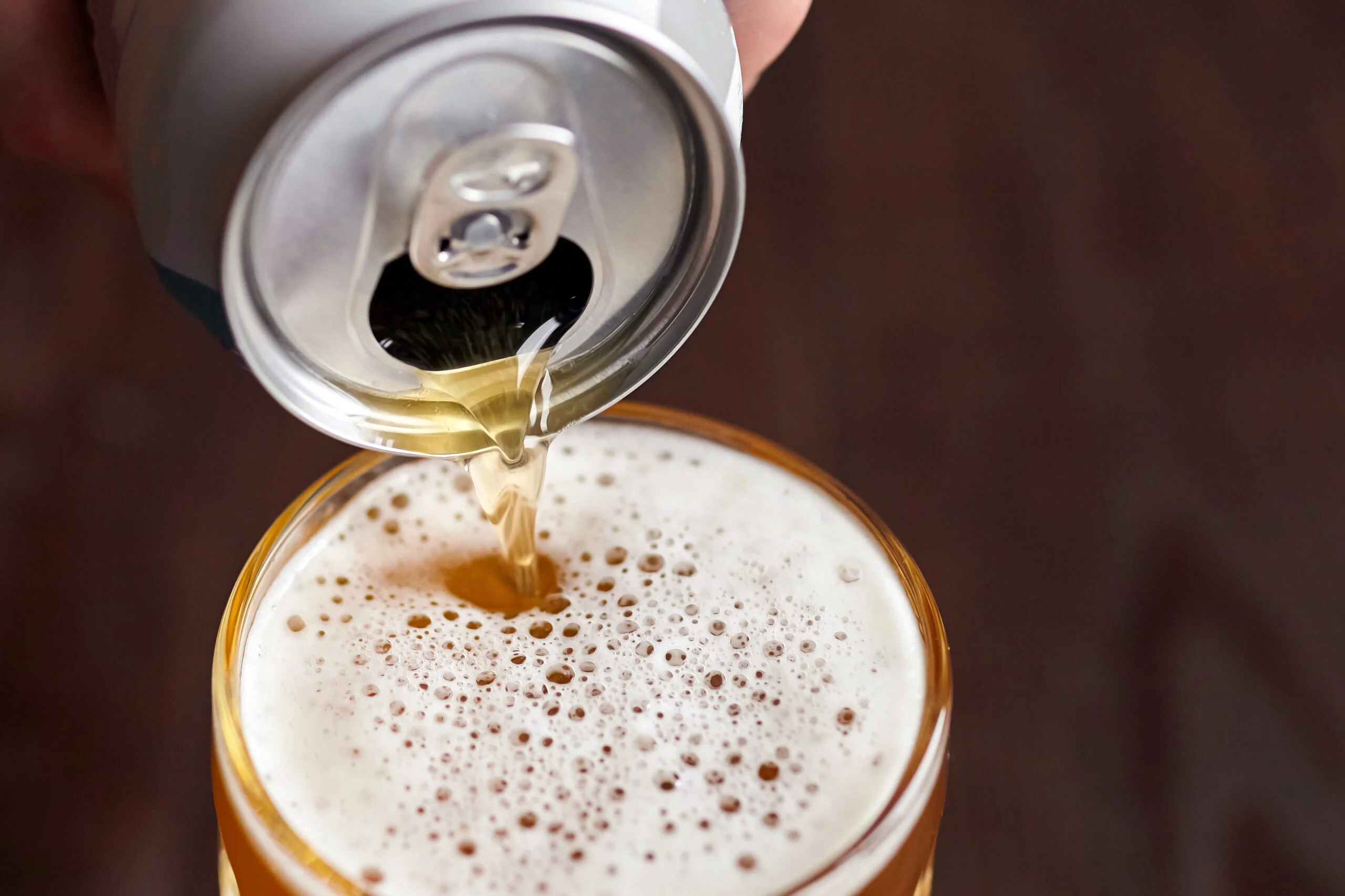 Canned beer pouring